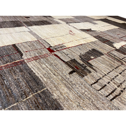 Gabbeh rug close-up: textured surface with light rectangles and red threads