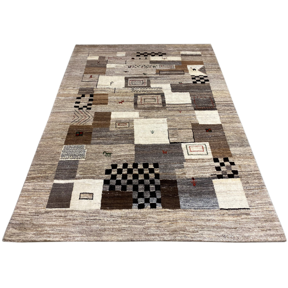 Rug with patchwork rectangles, black-and-white tiles, and beige sections with small accents