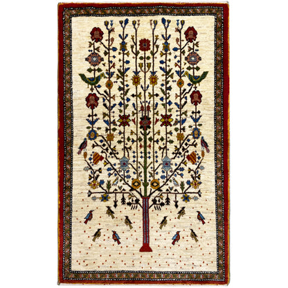Gabbeh rug with a beige background, red border, and tree floral pattern in blue and red