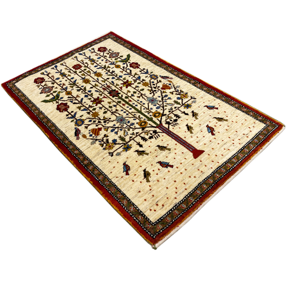 Rectangular Gabbeh rug with a beige base, red border, and medium tree-vine pattern