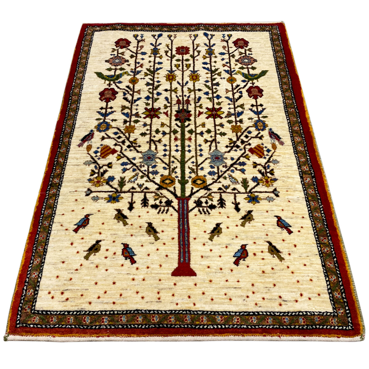 Gabbeh rug with a beige background, red central tree, and multicolored border