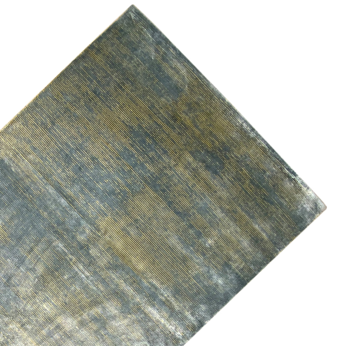 Designer rug up close: blue-gray mottled fabric with gold areas