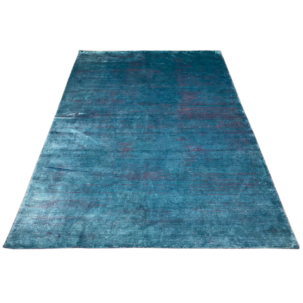 Designer rug in blue with an all-over pattern and a distressed vintage look