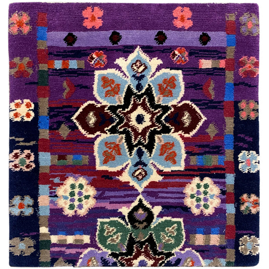 Rug 77x62 cm with a purple background and multicolored ornamental pattern