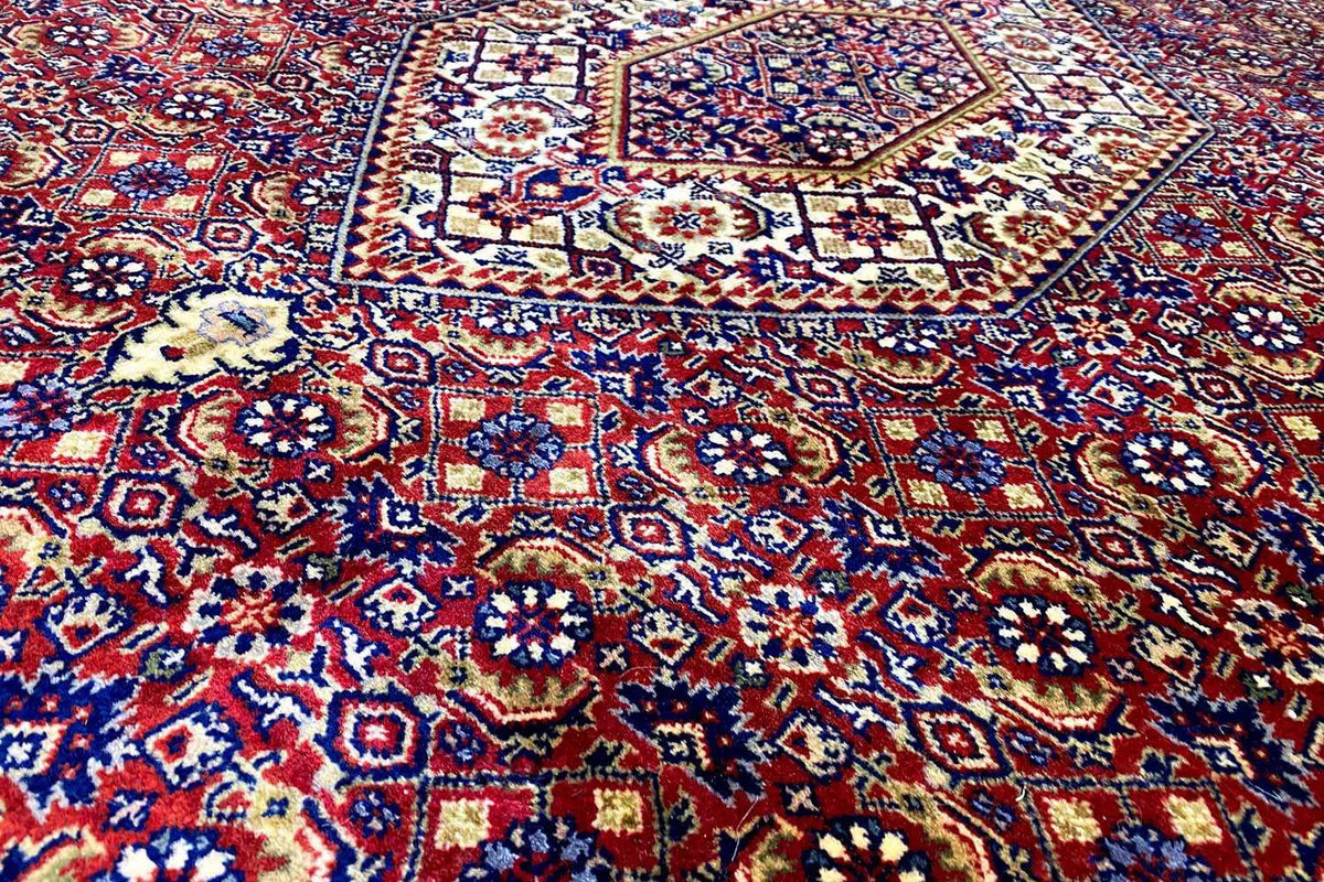 Bidjar rug detail: dense blue-red-white ornamental pattern