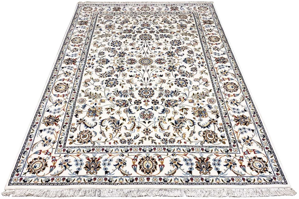 Beige Indo-Nain rug with a central medallion, wide border, and fringes