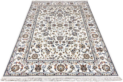 Beige Indo-Nain rug with a central medallion, wide border, and fringes