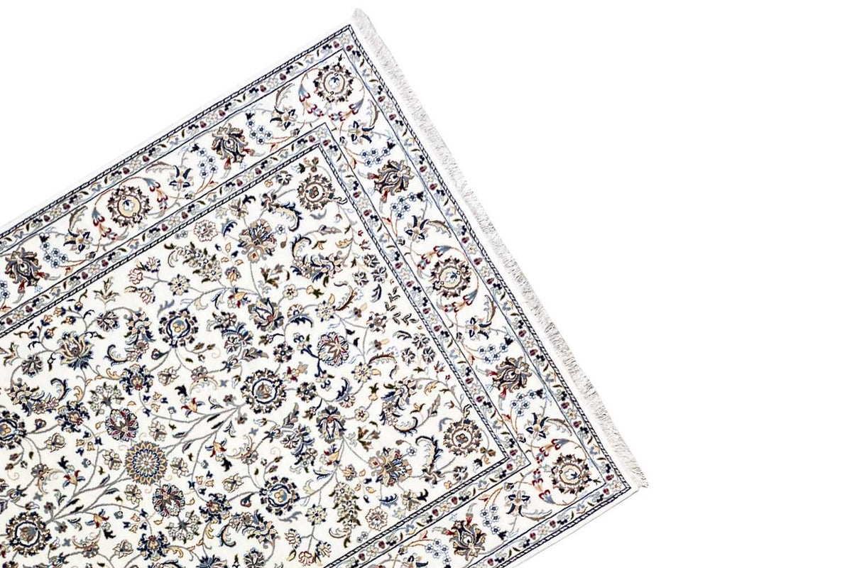Beige carpet with a border along the edge, circular medallions, and floral vines