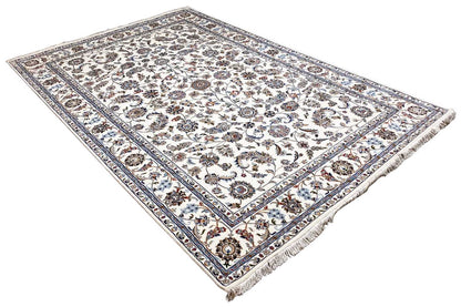 Beige Oriental rug with a floral medallion pattern and blue-brown decorative border