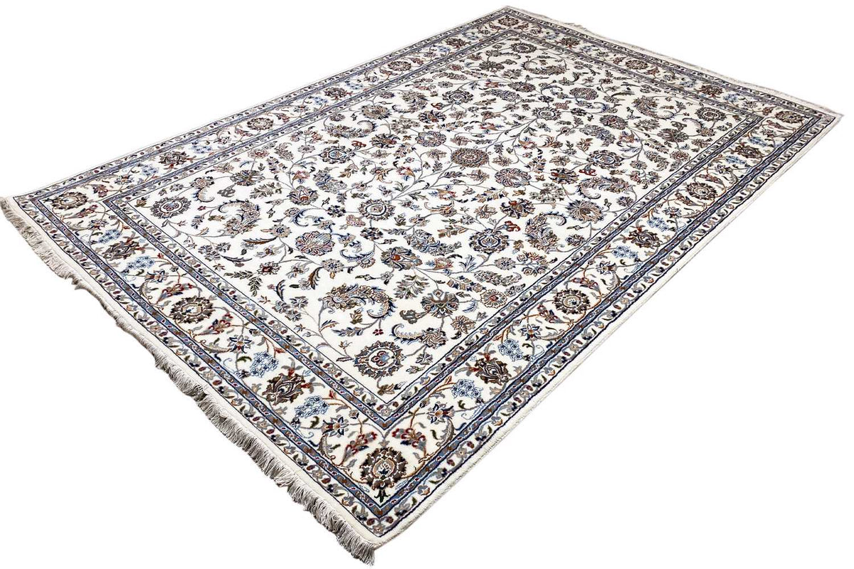 Beige oriental rug with a floral ornamental design and decorative border, visible fringes