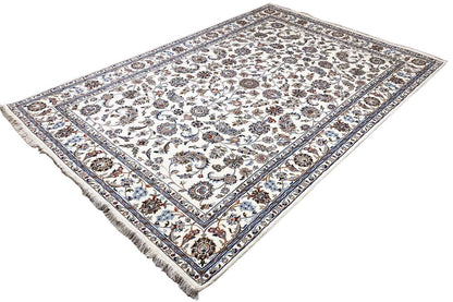 Beige oriental rug with a floral ornamental design and decorative border, visible fringes