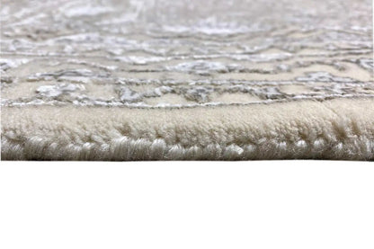 Rug edge with dense pile and light, mottled tones