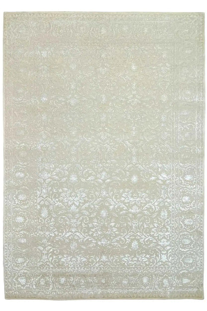 Light beige carpet with a fine damask pattern and a narrow border all around.