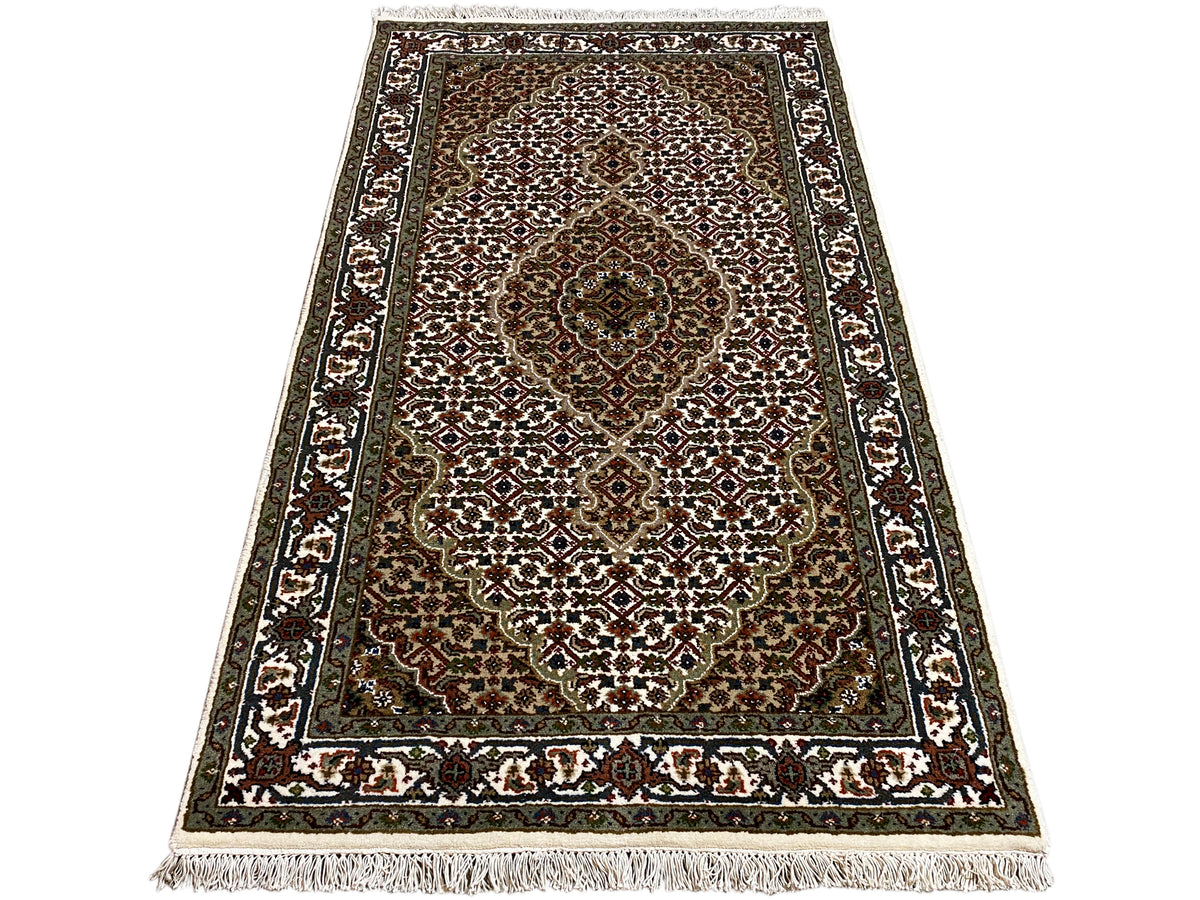 Indo Tabriz rug, rectangular: slightly slanted, central medallions and border