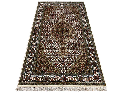 Indo Tabriz rug, rectangular: slightly slanted, central medallions and border