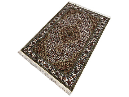 Indo Tabriz rug, rectangular: laid at an angle, brown-green field with ornamental borders