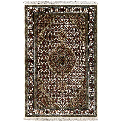 Indo Tabriz rug, rectangular: dark brown/green with a white ornamental border