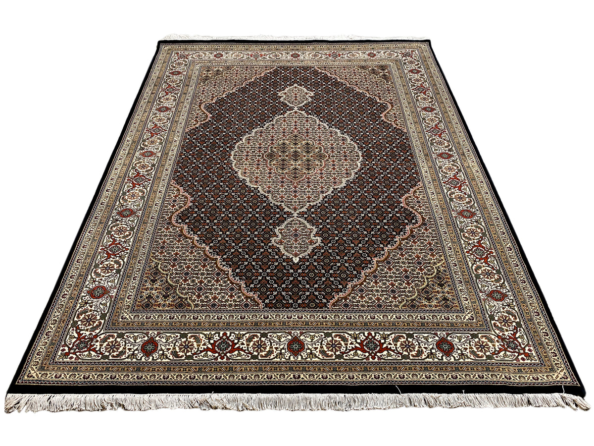 Tabriz-style rug, brown-beige base with medallion, visibly frayed edge
