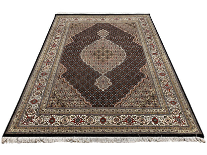 Tabriz-style rug, brown-beige base with medallion, visibly frayed edge