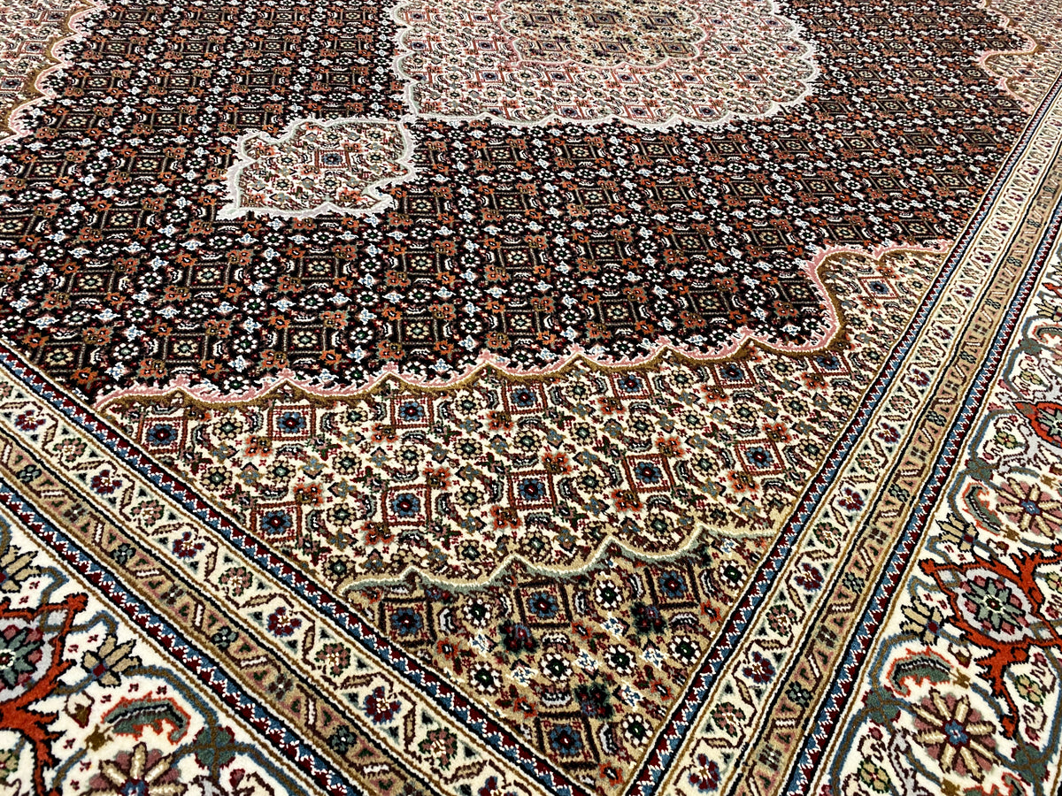Indo Tabriz rug with a dark background and delicate medallion ornaments