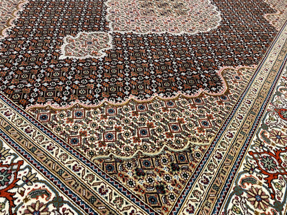 Indo Tabriz rug with a dark background and delicate medallion ornaments