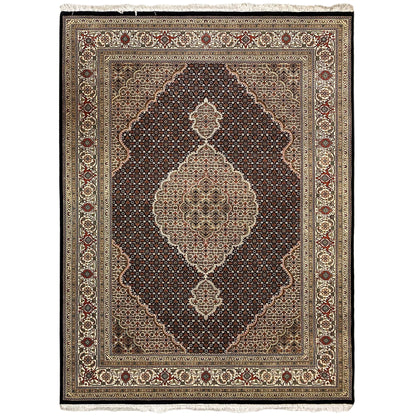Tabriz-style rug with a central medallion in beige, brown, and dark red