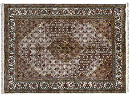 Indo Tabriz rug: Detail of the floral composition with border, brown and light