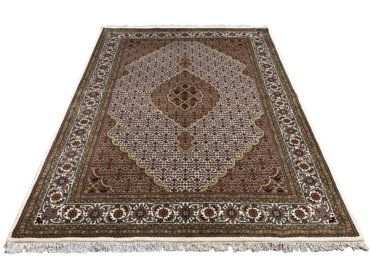Indo Tabriz rug: Rectangular rug with medallion design, brown, beige, fringes
