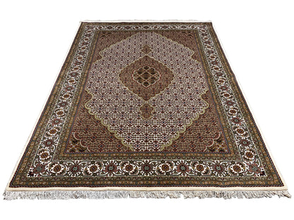 Indo Tabriz rug: Rectangular rug with medallion design, brown, beige, fringes