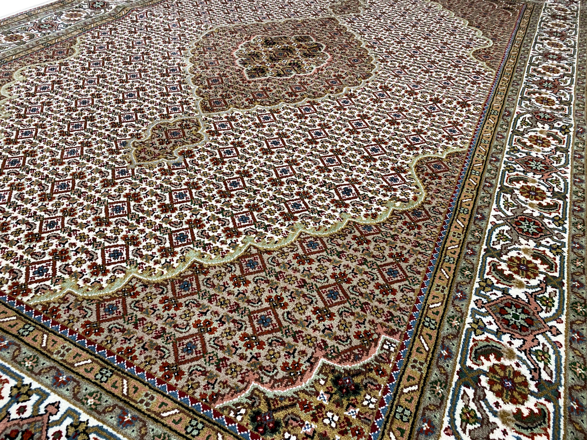Indo Tabriz rug: ornamental medallion, brown-beige pattern, border trim