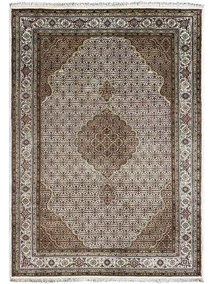 Brown and beige rug with a central medallion, surrounding border, and delicate pattern.