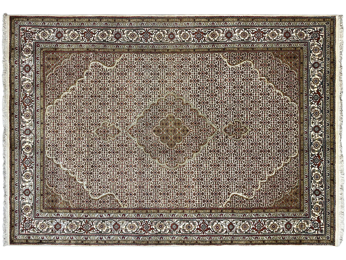Indo Tabriz rug with a large medallion, beige-brown ground, and delicate ornamental border