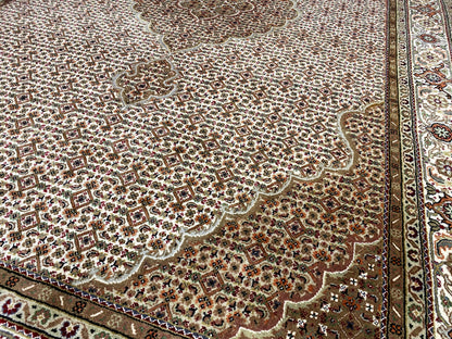 Oriental rug with a delicate ornamental pattern in beige, brown, and dark red, bordered