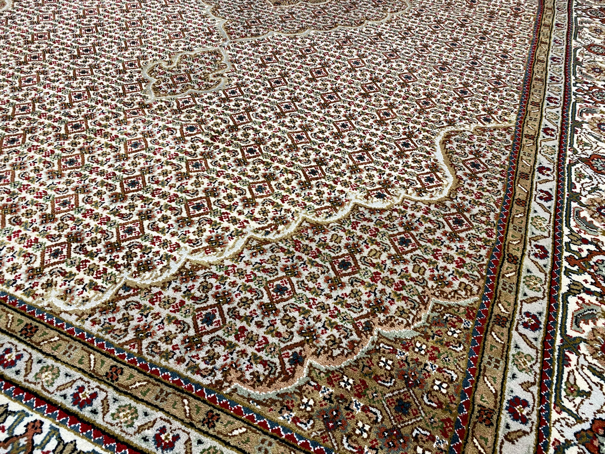 Indo Tabriz rug with an ornamental pattern, red background and decorative border