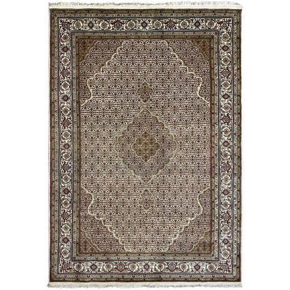 Indo Tabriz rug with an ornamental medallion, brown background, and decorative border
