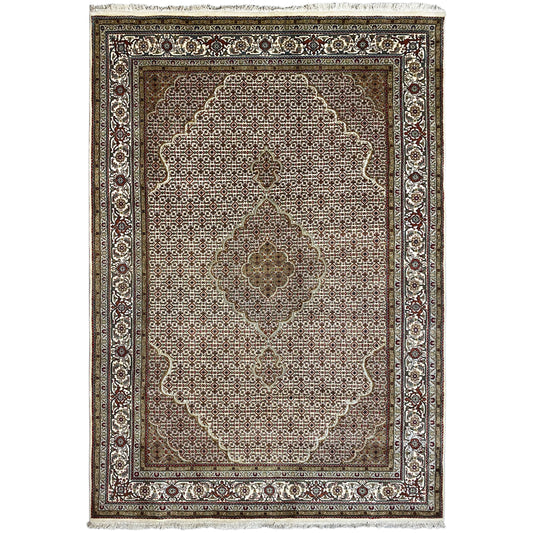 Indo Tabriz rug with an ornamental medallion, brown background, and decorative border