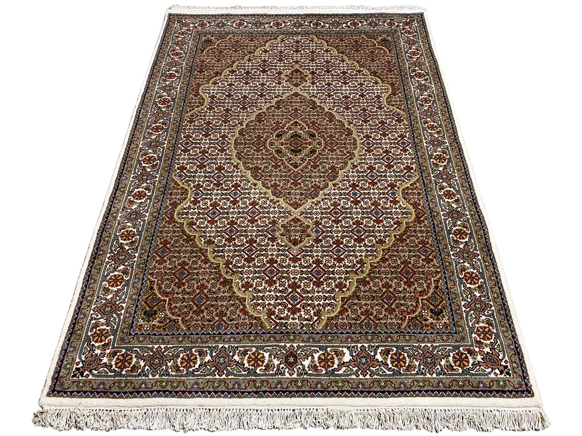 Indo Tabriz rectangular rug, brown-beige pattern with fringes along the edge
