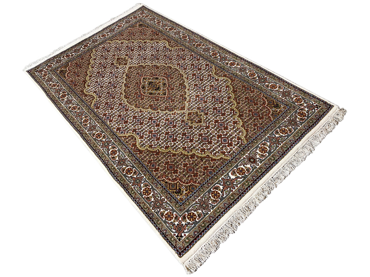 Indo Tabriz rug diagonal view, ornamental field pattern, fringe
