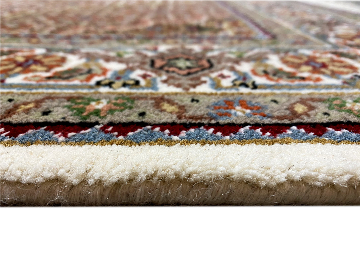 Indo Täbriz rug, detailed border and fringe, beige pile, color accents