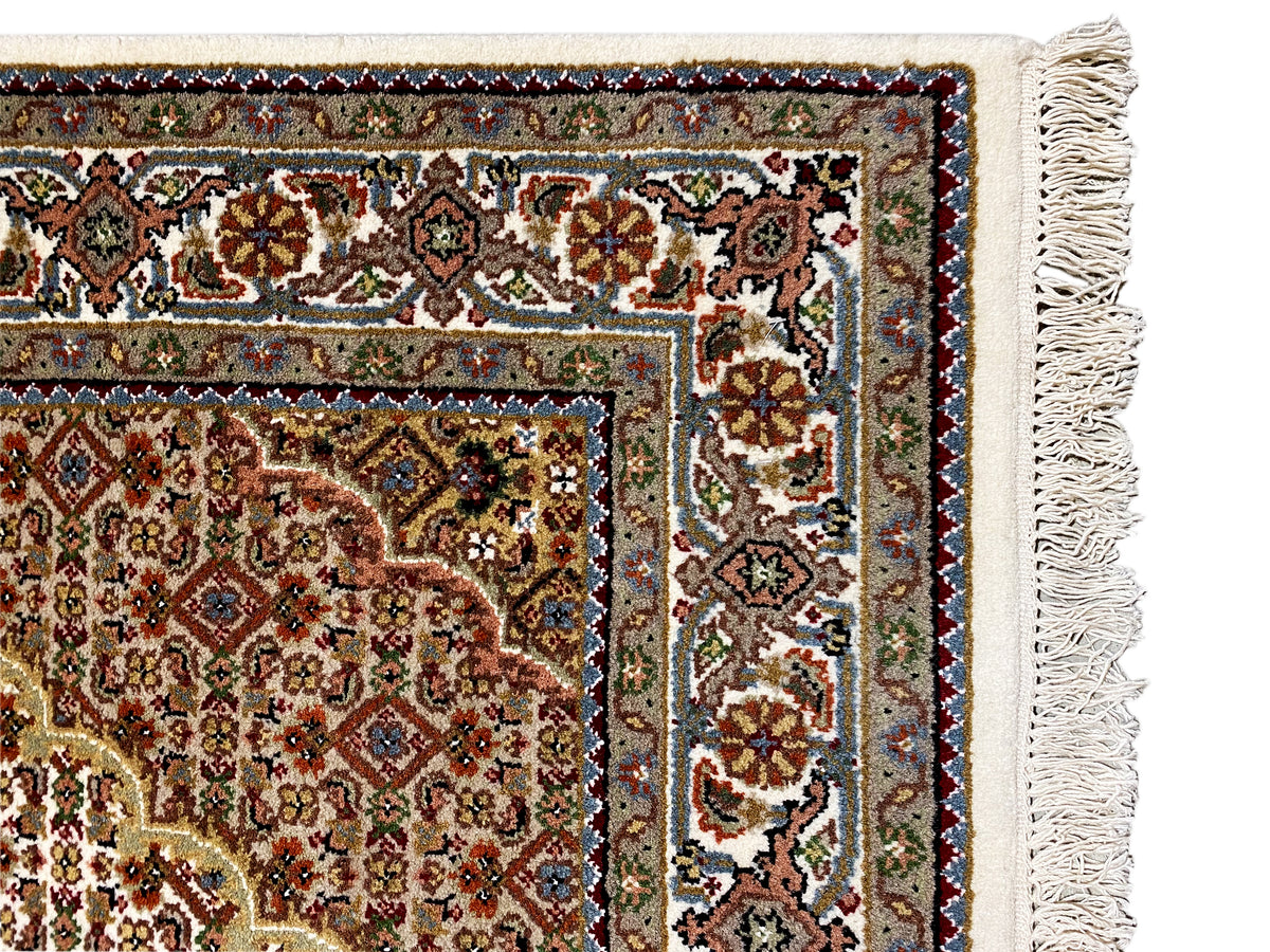Indo Tabriz rug edge detail with ornaments, fringes and border, multicolored