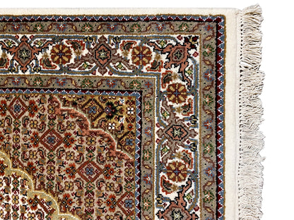Indo Tabriz rug edge detail with ornaments, fringes and border, multicolored