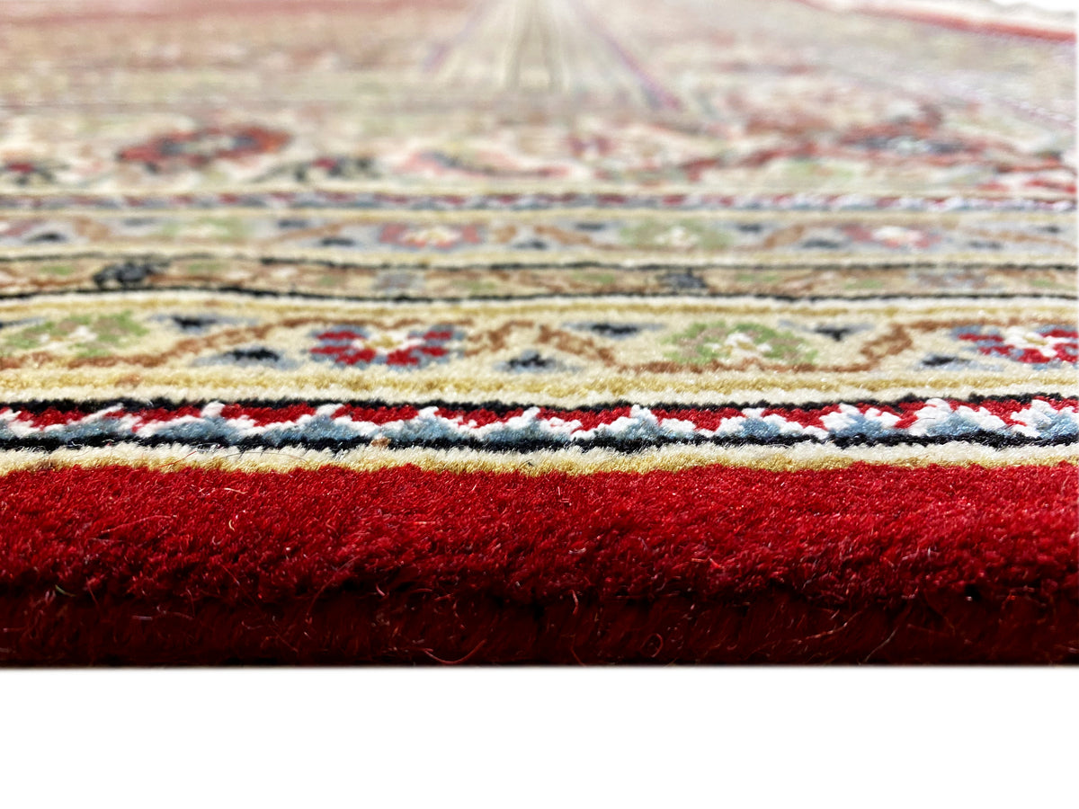 Indo Tabriz rug close-up: pile height and pattern edges with borders