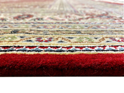 Indo Tabriz rug close-up: pile height and pattern edges with borders