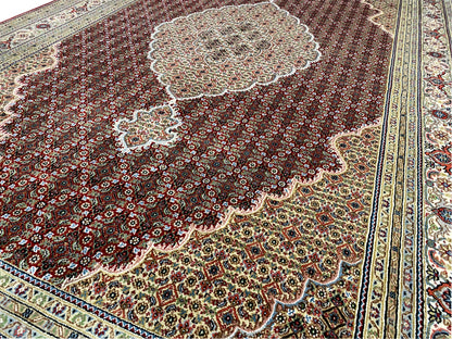 Indo Tabriz carpet close-up: medallions and ornaments along the border