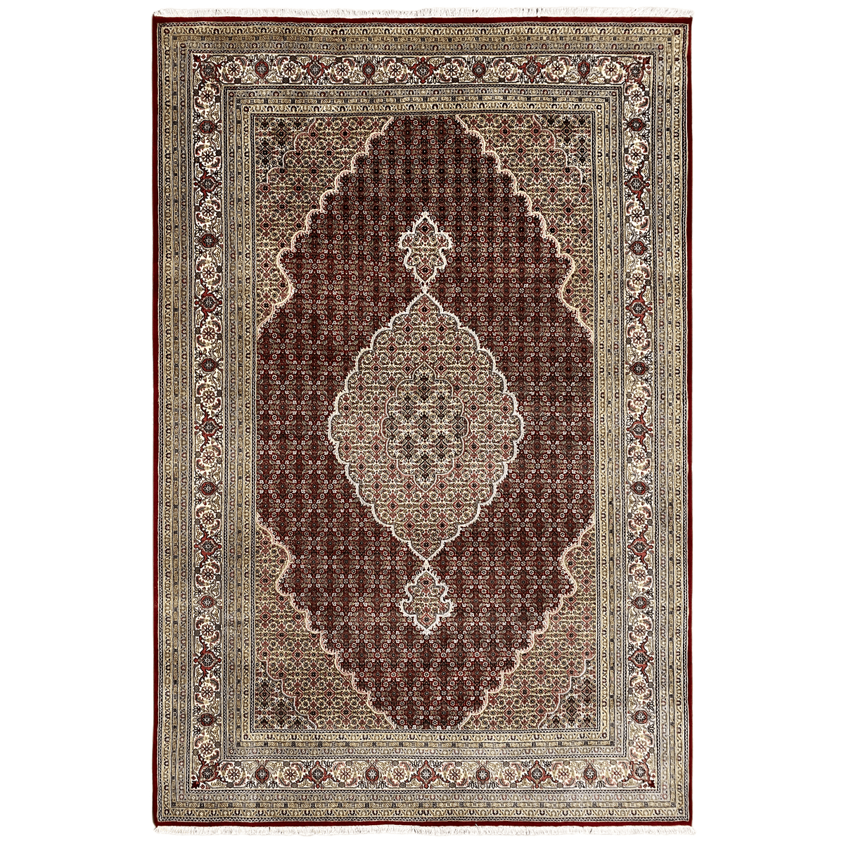 Indo Tabriz rug: dark red field, medallion ornament, beige border