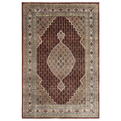 Indo Tabriz rug: dark red field, medallion ornament, beige border
