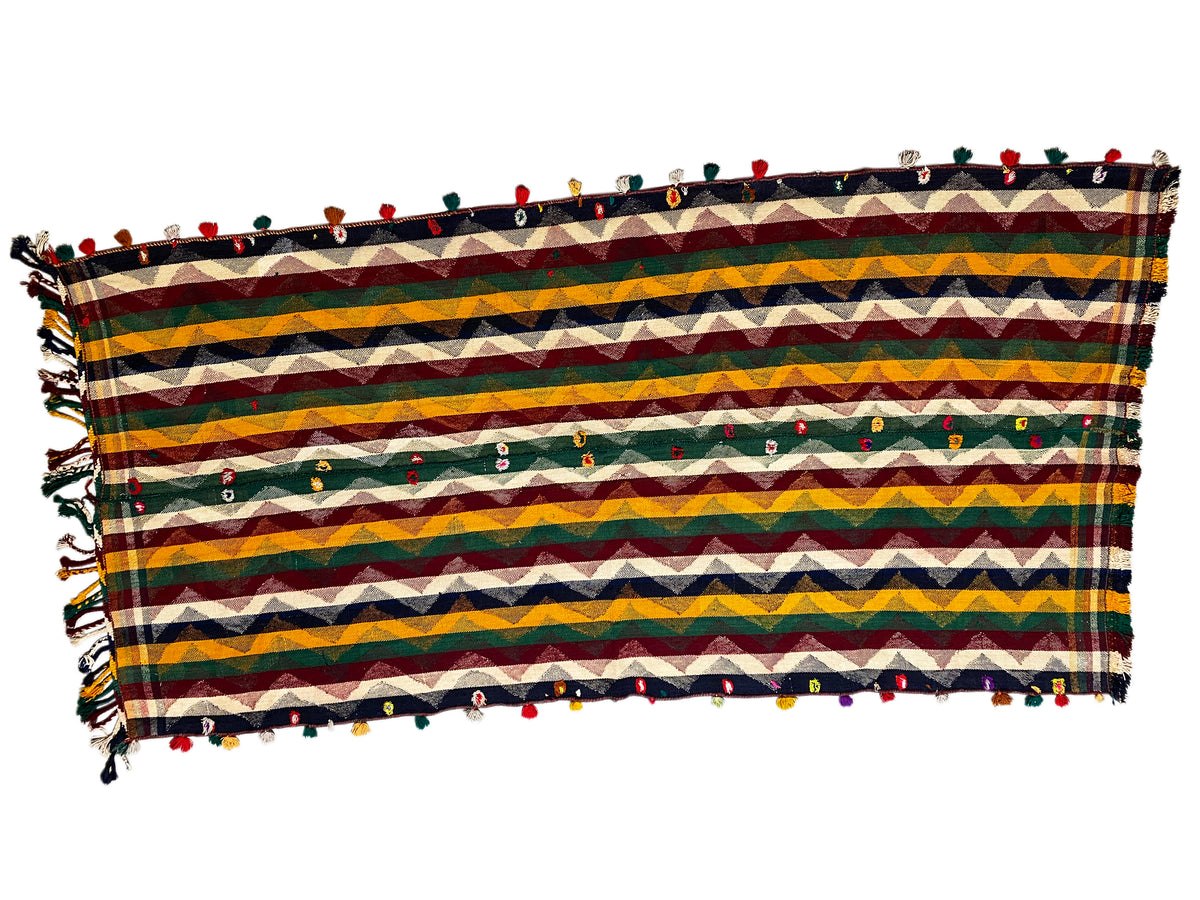 Jajim rug with horizontal blue, yellow, and red stripes and fringes around the edges