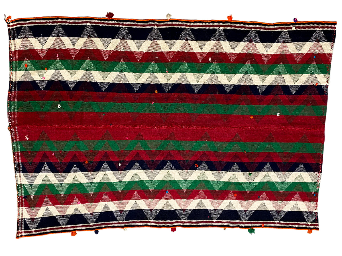 Jajim rug with a horizontal zigzag pattern in red, green, cream and dark blue