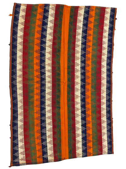 Rug with vertical stripes; bold colors such as orange, green, blue, and red