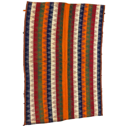 Rectangular rug with vertical stripes in orange, green, blue, red, and beige